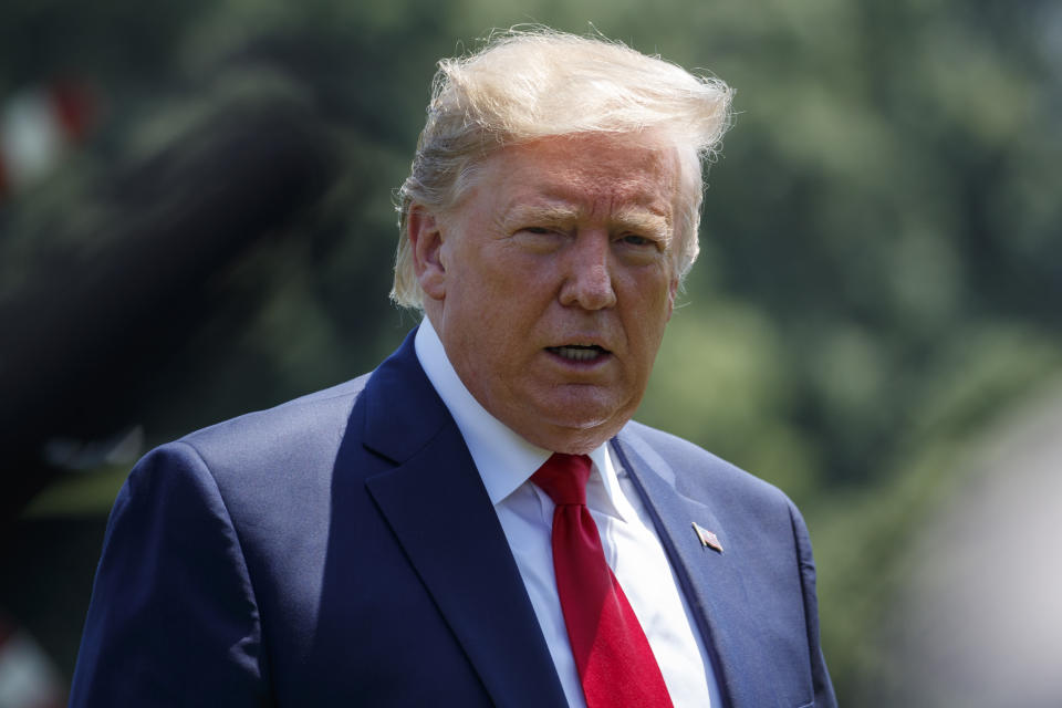 President Donald Trump prepares to speak to the media as arrives at the White House in Washington, Tuesday, July 30, 2019, as the returns from Virgina. (AP Photo/Carolyn Kaster)