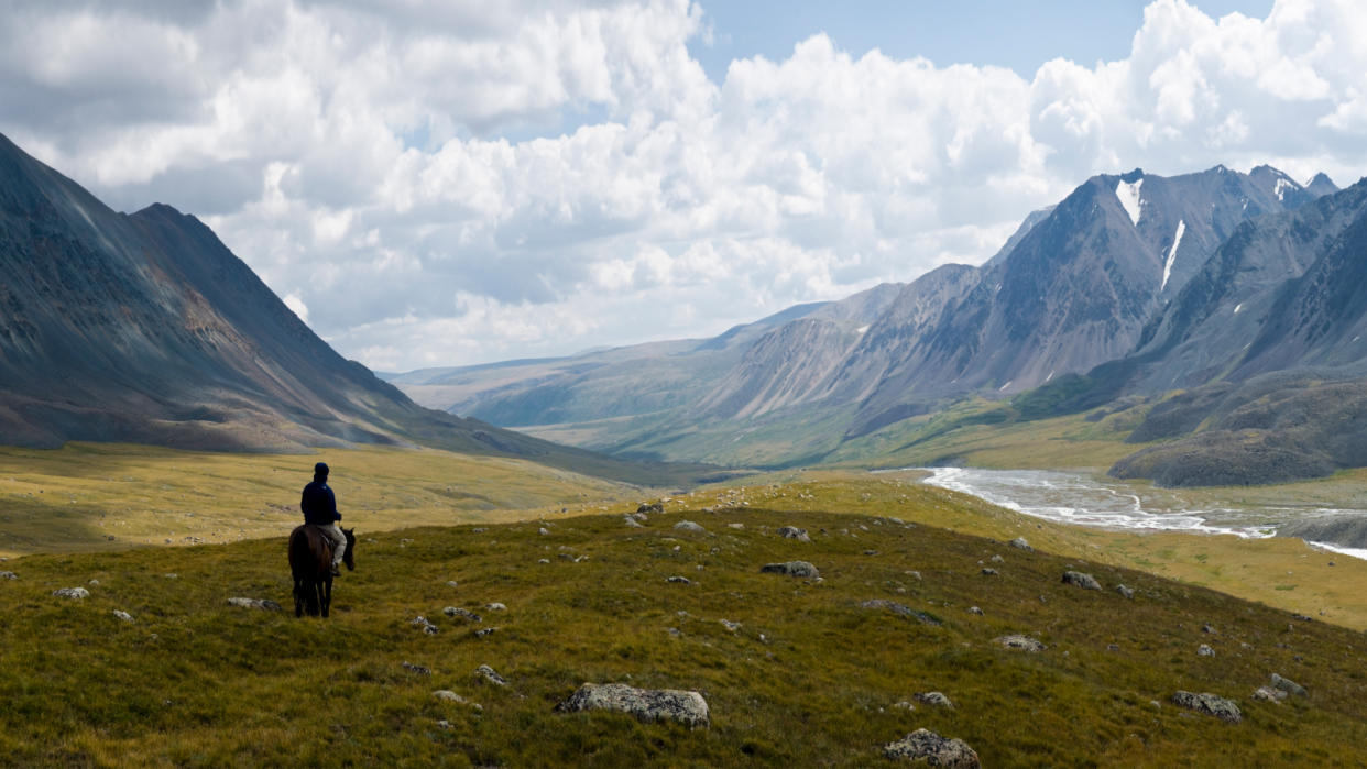  A lonely rider at Altay Mountains. 