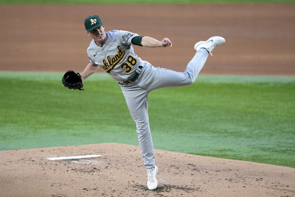 Oakland Athletics starting pitcher JP Sears follows through on his delivery to a Texas Rangers batter during the first inning of a baseball game, Friday, April 21, 2023, in Arlington, Texas. (AP Photo/Tony Gutierrez)