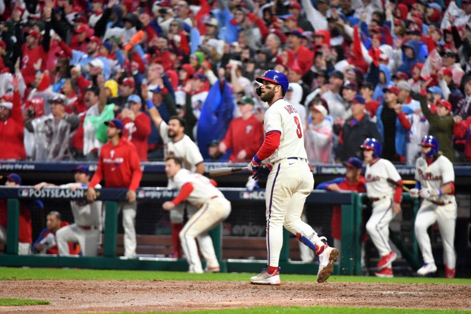 Game 5: Phillies designated hitter Bryce Harper follows the flight of his go-ahead two-run home run in the eighth inning against the Padres at Citizens Bank Park in Philadelphia.