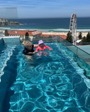 <p>Rebel Wilson/instagram</p> Wilson posted a photo of her in a rooftop pool with her daughter Royce