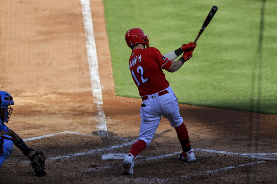 Cincinnati Reds' Tyler Naquin hits a two-run RBI single during the third inning of a baseball game against the St. Louis Cardinals in Cincinnati, Saturday, April 3, 2021. (AP Photo/Aaron Doster)