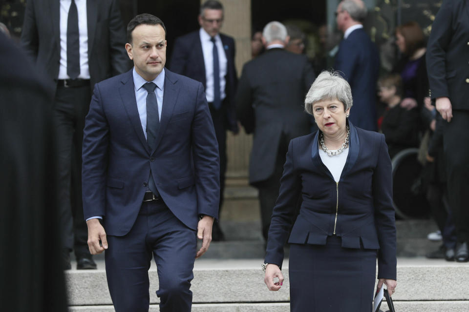 Britain's Prime Minister Theresa May, right and Ireland Prime Minister Leo Varadkar leave after the funeral service of journalist Lyra McKee, at St Anne's Cathedral in Belfast, northern Ireland, Wednesday April 24, 2019. The leaders of Britain and Ireland joined hundreds of mourners Wednesday at the funeral of Lyra McKee, the young journalist shot dead during rioting in Northern Ireland last week. (Brian Lawless/PA via AP)