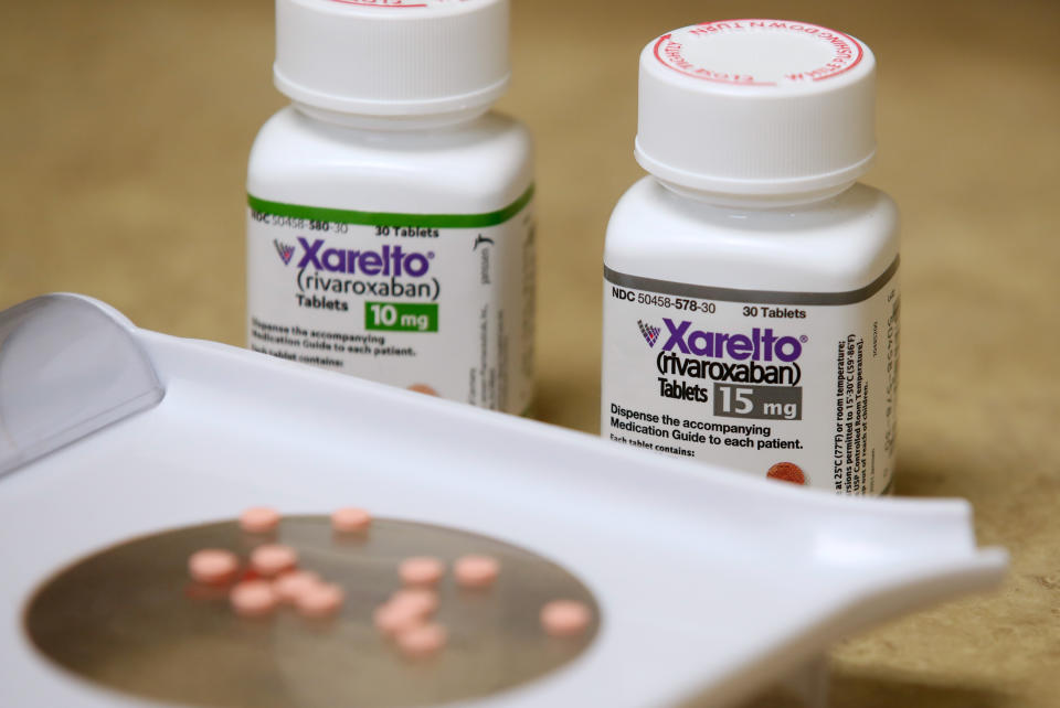 Bottles and pills of Xarelto, marketed by Janssen Pharmaceutical, sit on a counter at a pharmacy in Provo, Utah, U.S. January 9, 2020.   REUTERS/George Frey