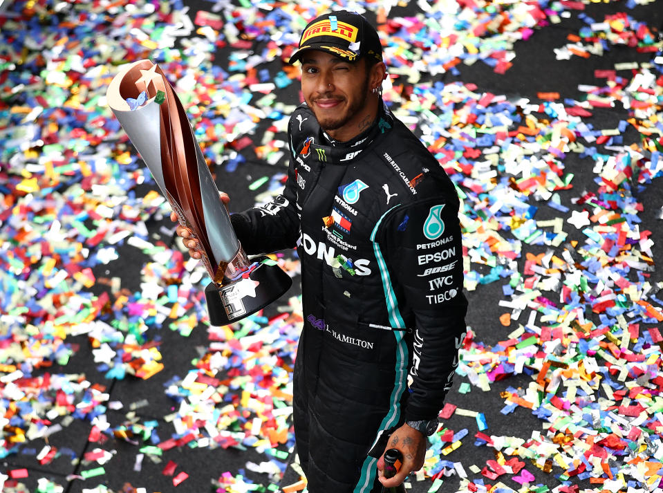ISTANBUL, TURKEY - NOVEMBER 15: Race winner Lewis Hamilton of Great Britain and Mercedes GP celebrates winning a 7th F1 World Drivers Championship on the podium during the F1 Grand Prix of Turkey at Intercity Istanbul Park on November 15, 2020 in Istanbul, Turkey. (Photo by Bryn Lennon/Getty Images)