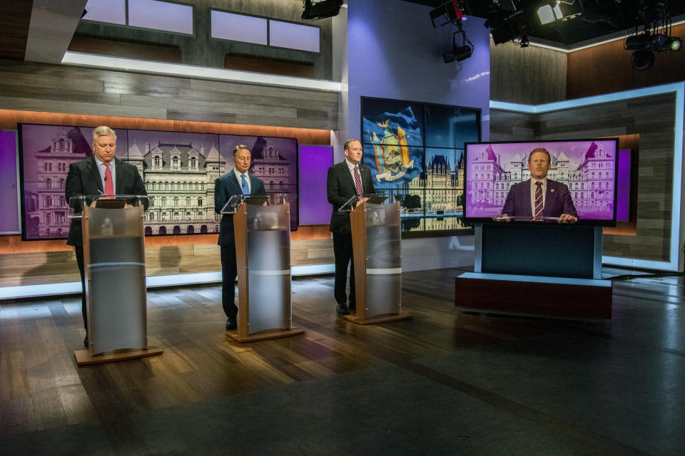 FILE - From left to right, businessman Harry Wilson, former Westchester County Executive Rob Astorino, Rep. Lee Zeldin, and Andrew Giuliani, son of former New York City Mayor Rudy Giuliani, face off during New York's Republican gubernatorial debate at the studios of Spectrum News NY1 on June 20, 2022, in New York. New York's Republican primary for nominees for governor and lieutenant governor is Tuesday, June 28. (Brittainy Newman/Newsday via AP, Pool, File)