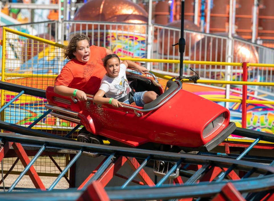Visitors enjoy the rides at the Pensacola Interstate Fair Sunday, October 23, 2022. The 2023 fair runs Oct. 19-29, 2023.