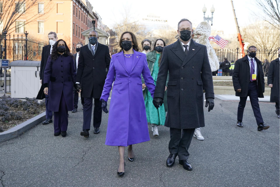 Vice President Kamala Harris, and her husband Doug Emhoff, walk during the Inauguration Day Parade Route in Washington, Wednesday, Jan. 20, 2021, after being sworn in as the 46th vice president of the United States. (AP Photo/Jacquelyn Martin)