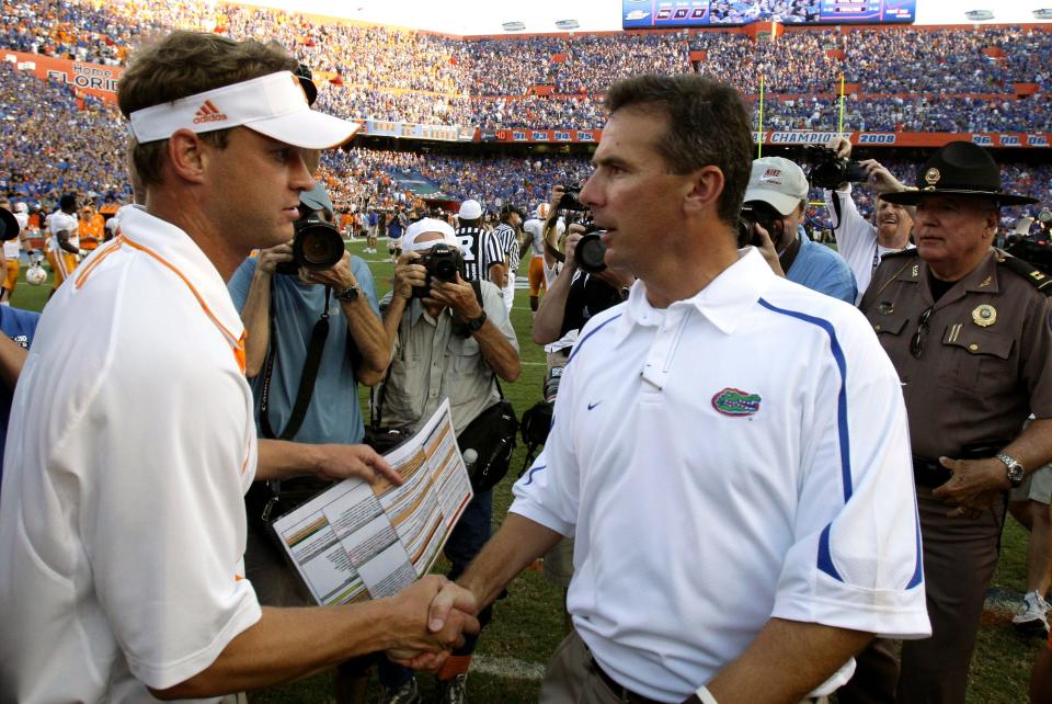 Lane Kiffin, left, and Urban Meyer shake hands after the Gators beat the Volunteers in 2009.