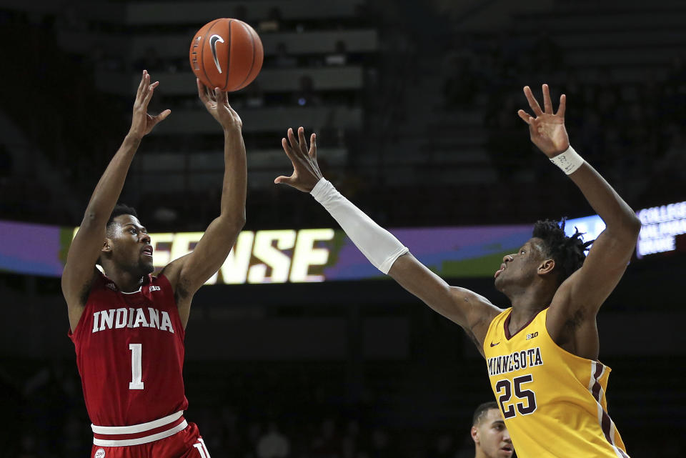 Indiana's Al Durham shoots over Minnesota's Daniel Oturu during the second half of an NCAA college basketball game Wednesday, Feb. 19, 2020, in Minneapolis. Indiana won 68-56. (AP Photo/Stacy Bengs)