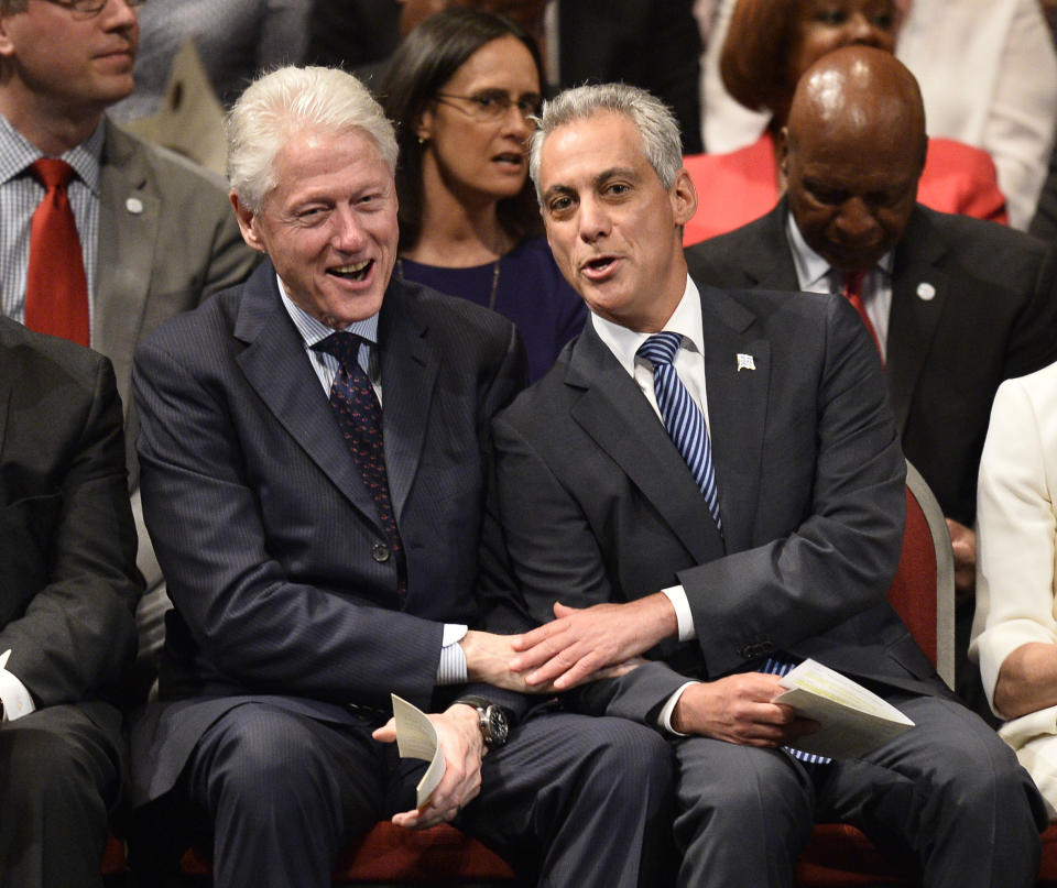 Emanuel bonds with former President Bill Clinton in 2015. As an aide to Clinton, Emanuel helped drive the North American Free Trade Agreement through Congress, rankling unions. (Photo: Brian Kersey via Getty Images)