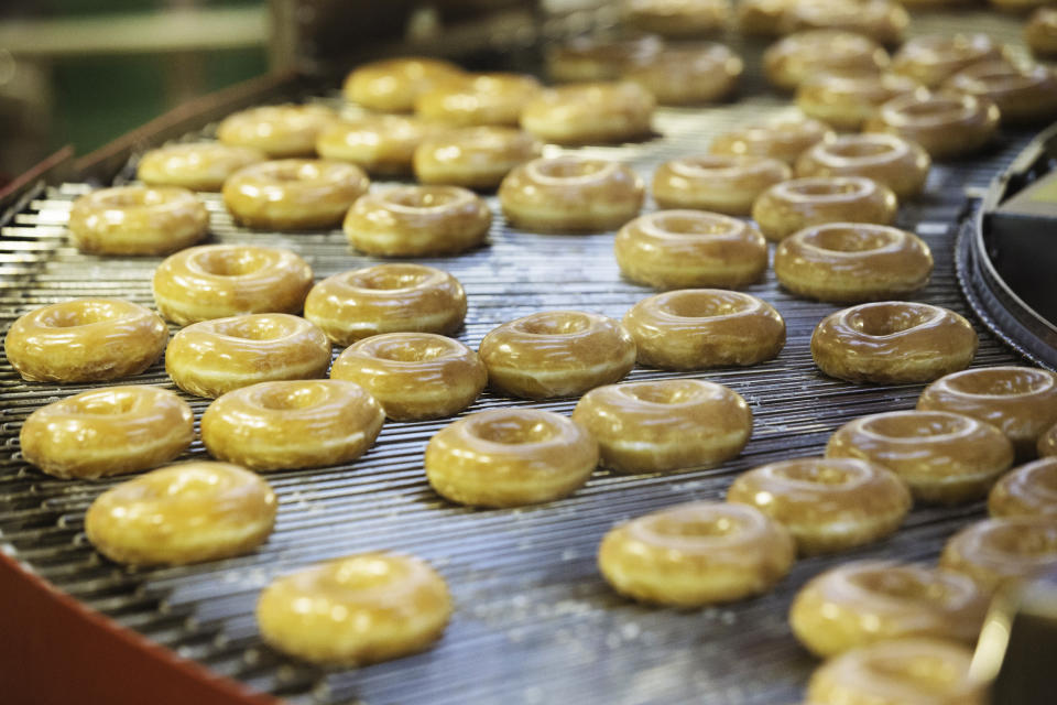 Doughnuts on a production line inside a Krispy Kreme store in Times Square on Sept. 10, 2020, in New York. (Angus Mordant / Bloomberg via Getty Images file)