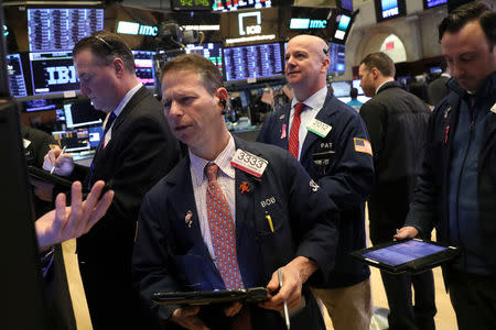 Traders work on the floor of the New York Stock Exchange (NYSE) in New York, U.S., January 17, 2019. REUTERS/Brendan McDermid