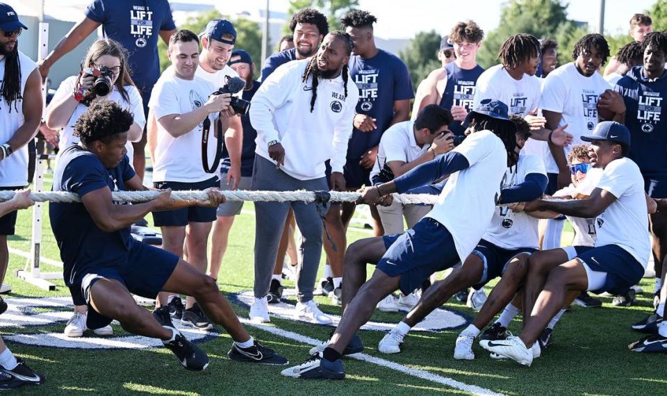 Penn State football players compete in a tug-of-war to finish of the Nittany Lions annual Lift For Life event at University Park Thursday, June 30, 2022.