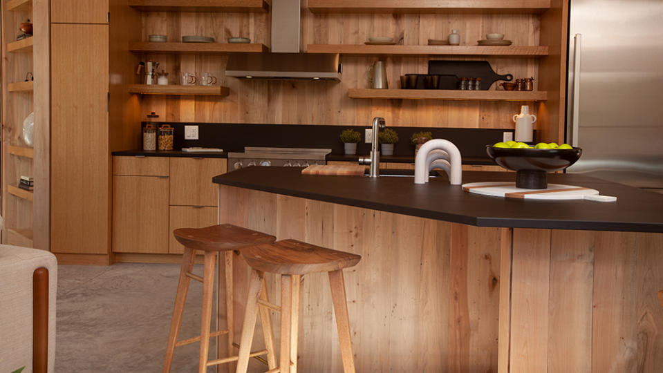 The kitchen is at once woodsy and modern. - Credit: Photo: Marcus Brooks