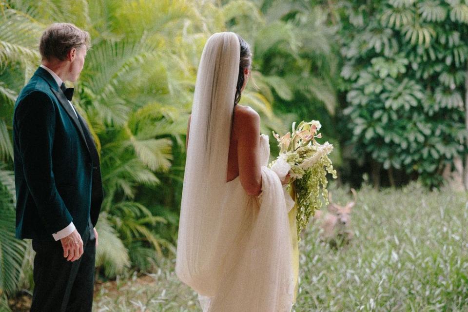 a man and woman in wedding attire