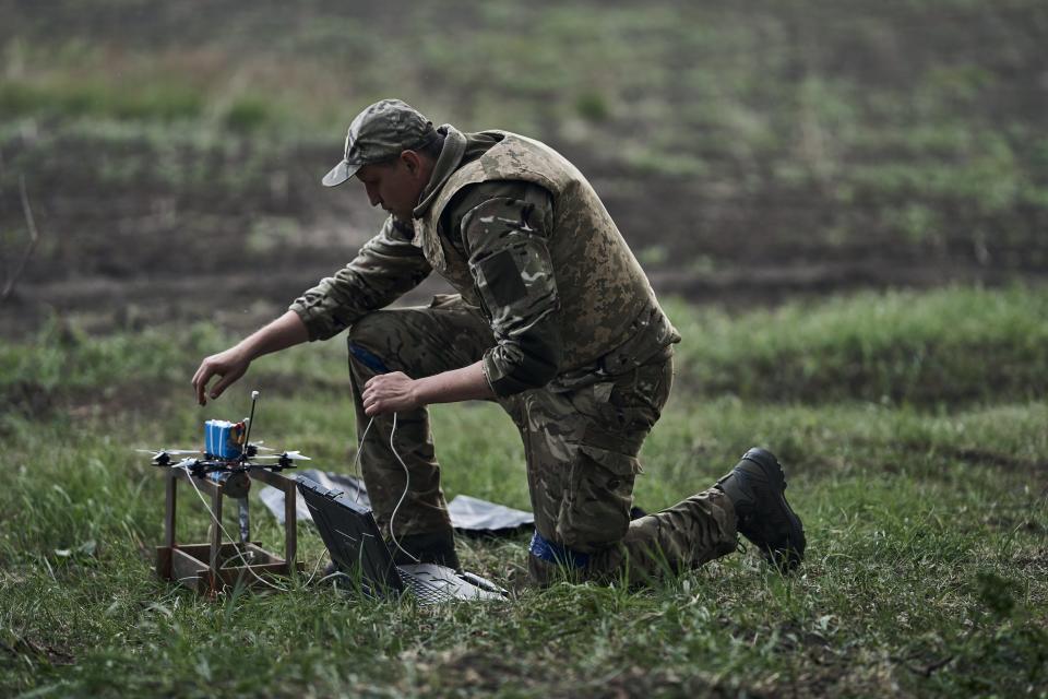 A Ukrainian drone pilot prepares a first-person view (FPV) attack drone for a combat flight in the Kharkiv region, less than five miles from the Russian border (Getty Images)