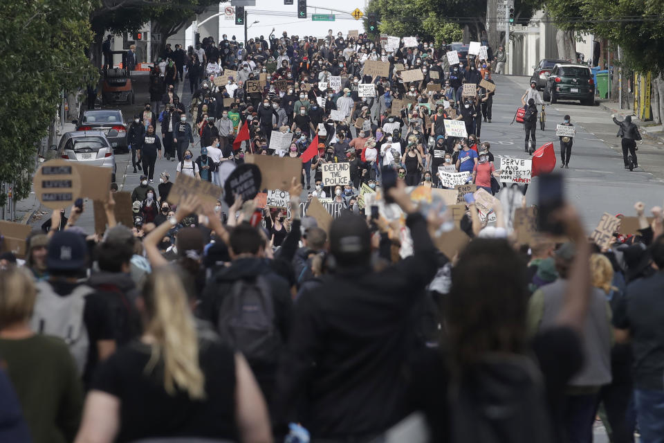 Groups of marchers meet up in San Francisco, Sunday, May 31, 2020, at protests over the Memorial Day death of George Floyd. Floyd was a black man who was killed in police custody in Minneapolis on May 25. (AP Photo/Jeff Chiu)