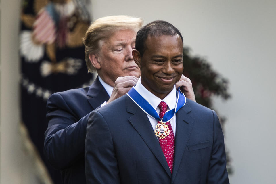 President Donald Trump presents Tiger Woods with the Presidential Medal of Freedom in 2019. (Photo by Jabin Botsford/The Washington Post via Getty Images)