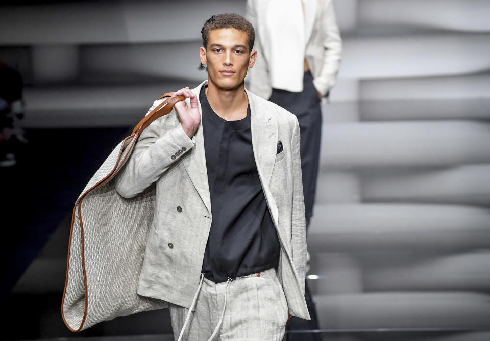 A model wears a creation as part of the Emporio Armani men's Spring Summer 2023 collection presented in Milan, Italy, Saturday, June 18, 2022. (AP Photo/Nicola Marfisi)