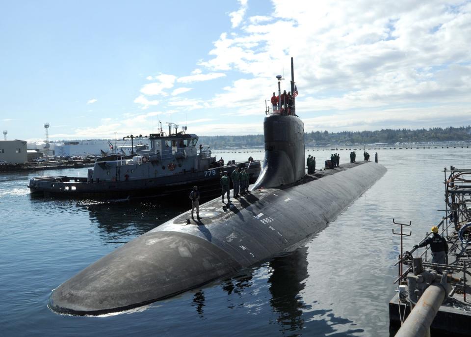 The Seawolf-class attack submarine USS Connecticut, seen here in a 2012 file photo, arrives at Naval Base Kitsap after completing a deployment.