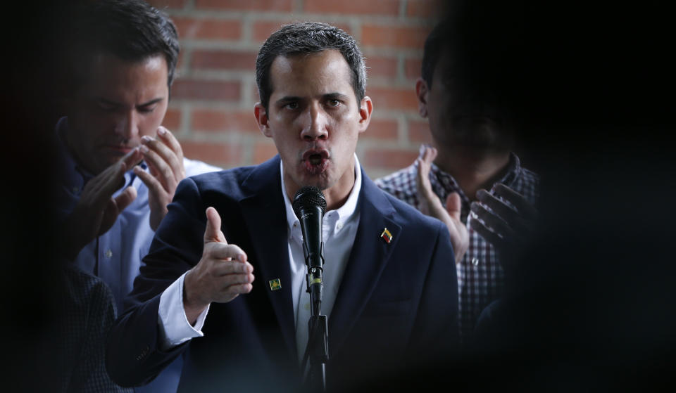 Opposition leader Juan Guaido, who has declared himself interim president of the country, talks during a press conference at a school he delivered humanitarian aid, in Caracas, Venezuela, Thursday, March 21, 2019. Guaido says the Venezuelan government is weak and doesn't "dare" to detain him. Guaido spoke Thursday after intelligence agents staged an overnight raid and detained Roberto Marrero, his key aide. (AP Photo/Natacha Pisarenko)