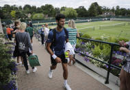 Serbia's Novak Djokovic leaves after playing a practice session ahead of the Wimbledon Tennis Championships in London Sunday, June 30, 2019. (AP Photo/Ben Curtis)