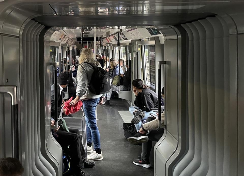 Members of the public on a Elizabeth Line train at standstill outside Royal Oak station in London (Alan Hamilton/PA) (PA Wire)