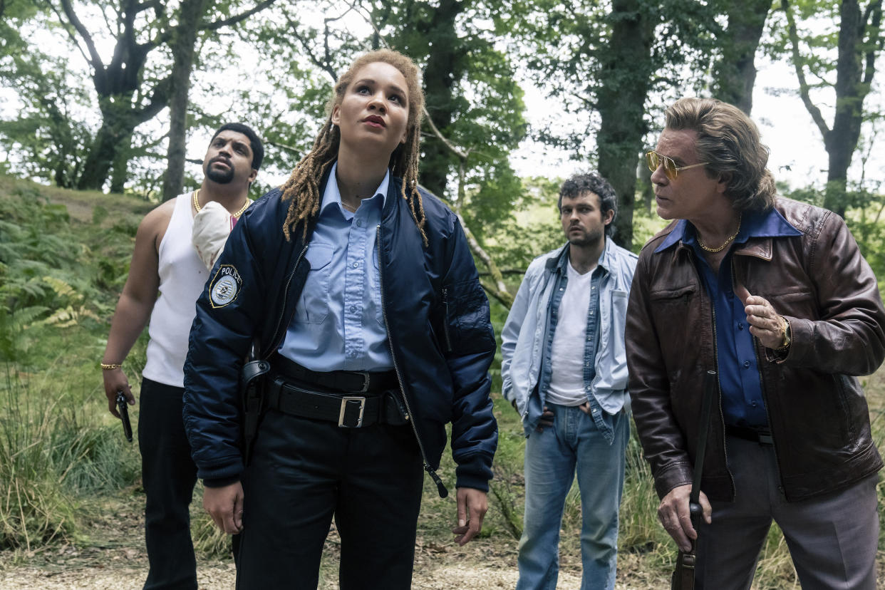 This image released by Universal Pictures shows O'Shea Jackson, Jr., from left, Ayoola Smart, Alden Ehrenreich and Ray Liotta in a scene from "Cocaine Bear." (Universal Pictures via AP)