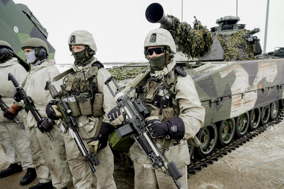 A view of soldiers as forces from Norway, Sweden and Finland meet at the border between the three countries for a NATO training exercise, in Kautokeino, Norway, Saturday, March 9, 2024, Large NATO drills in the frigid fjords of northern Norway may be just war games meant to hone the skills of the newly expanded 32-nation military alliance in the event of conflict. But for the troops taking part, they are very real. (Heiko Junge /NTB Scanpix via AP)