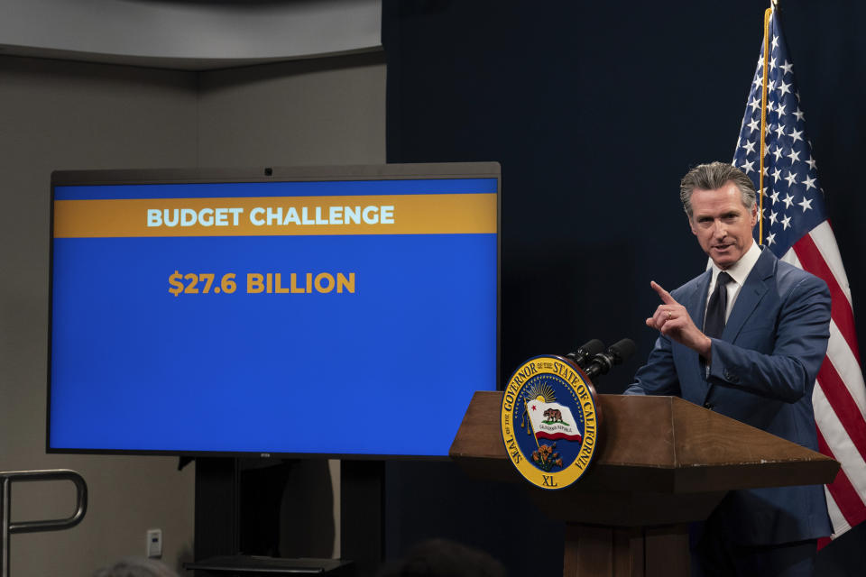 California Gov. Gavin Newsom unveils his revised 2024-25 state budget during a news conference in Sacramento, Calif., Friday, May 10, 2024. Newsom said the state's budget deficit has grown by $7 billion. In January, Newsom said the deficit was nearly $38 billion. However, in March Newsom and lawmakers agreed on some actions to reduce that deficit by $17.3 billion. Now, Newsom says the remaining deficit is $27.6 billion (AP Photo/Rich Pedroncelli)