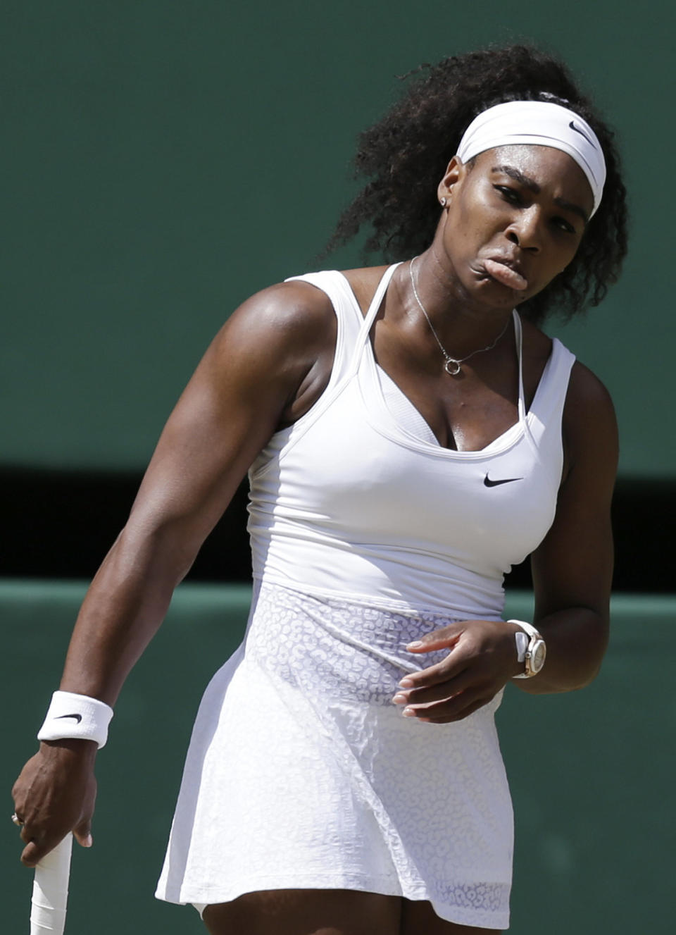 Serena Williams of the United States reacts after a point, during the women's singles final against  Garbine Muguruza of Spain, at the All England Lawn Tennis Championships in Wimbledon, London, Saturday July 11, 2015. (AP Photo/Pavel Golovkin)