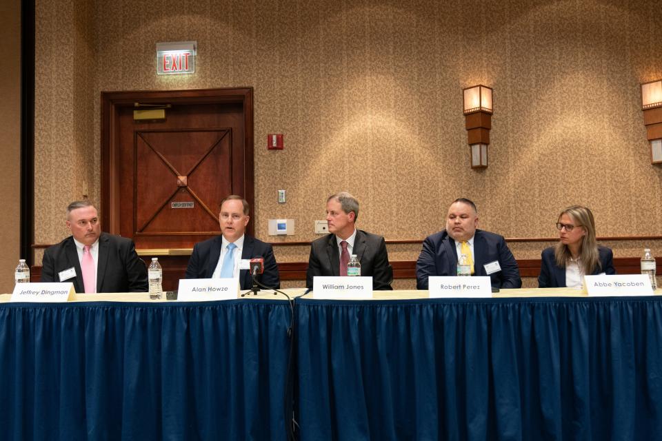 Candidates for the Topeka city manager position, from left, Jeffrey Dingman, Alan Howze, William Jones, Robert Perez and Abbe Yacoben answer questions from the media Monday prior to a meet-and-greet event at Hotel Topeka.