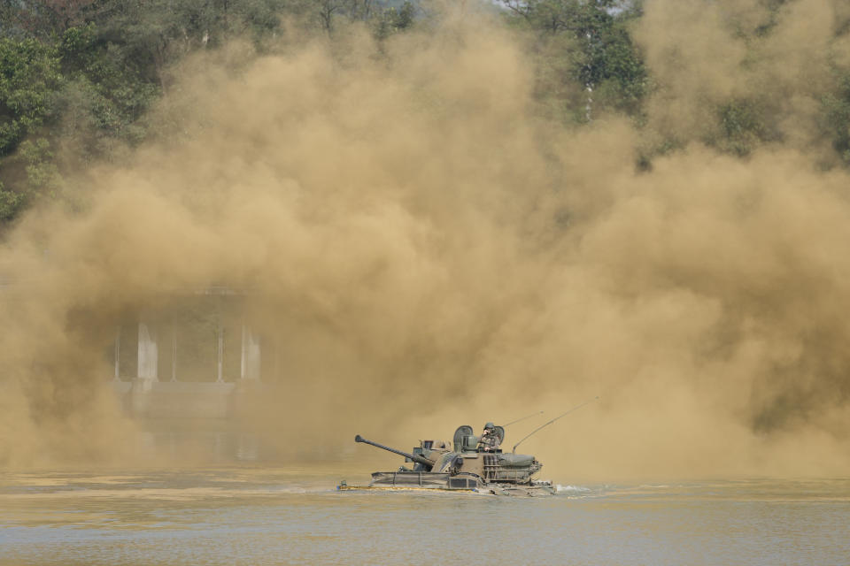 South Korea's K21 infantry fighting vehicle makes its way to shores in a smoke during the combined wet gap crossing military drill between South Korea and the United States as a part of the Ulchi Freedom Shield military exercise in Cheorwon, South Korea, Thursday, Aug. 31, 2023. (AP Photo/Lee Jin-man)