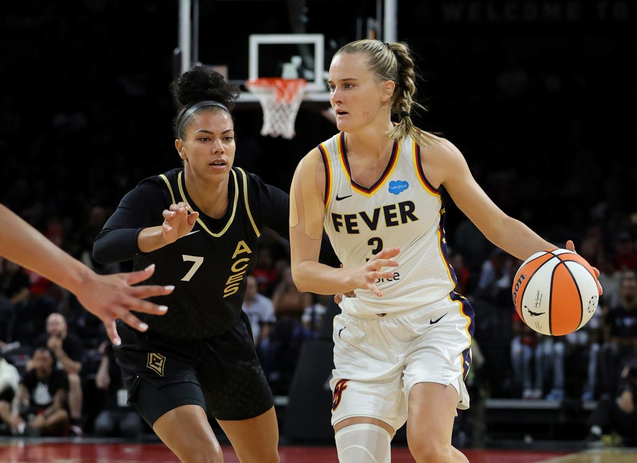 LAS VEGAS, NEVADA - JUNE 24: Kristy Wallace #3 of the Indiana Fever is guarded by Alysha Clark #7 of the Las Vegas Aces in the first quarter of their game at Michelob ULTRA Arena on June 24, 2023 in Las Vegas, Nevada. The Aces defeated the Fever 101-88.