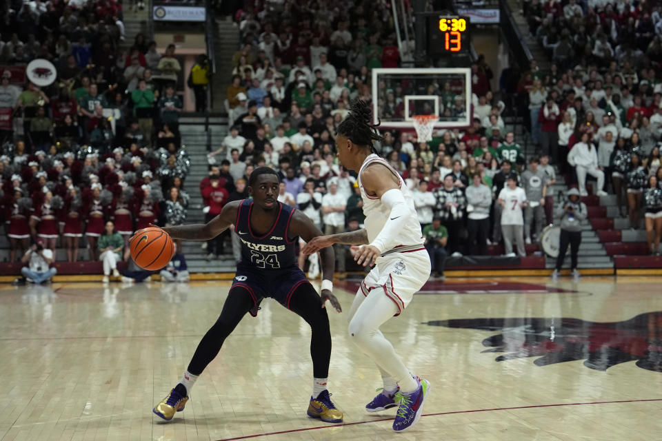 Dayton's Kobe Elvis, left, tries to get past Saint Joseph's Erik Reynolds II during the first half of an NCAA college basketball game, Tuesday, Feb. 6, 2024, in Philadelphia. (AP Photo/Matt Slocum)