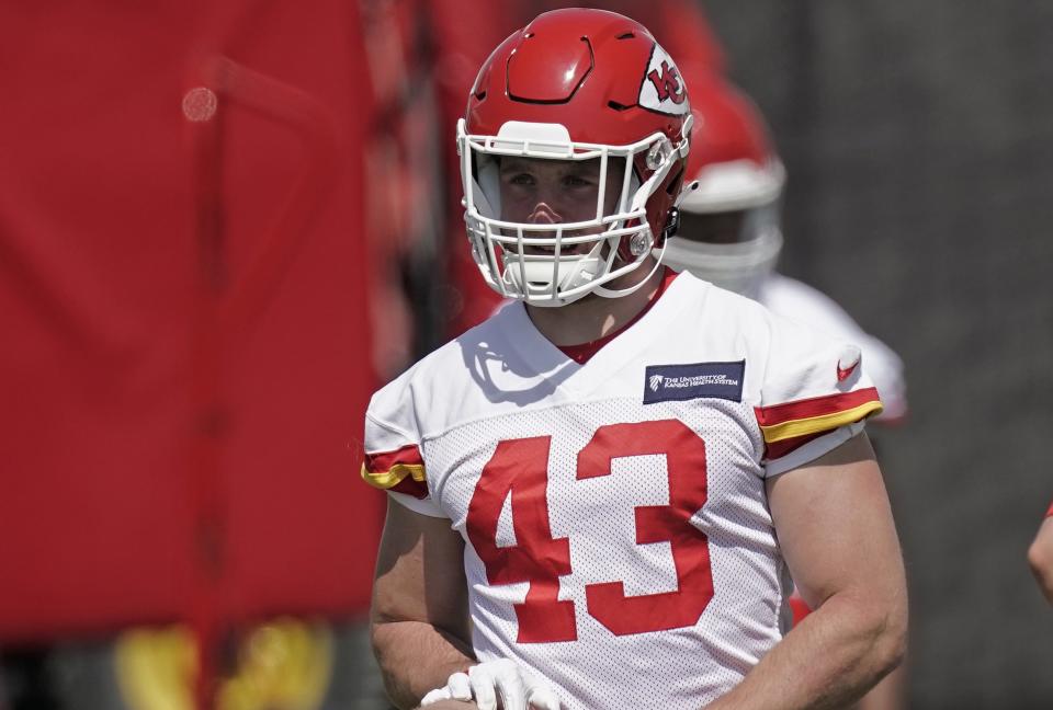 Kansas City Chiefs linebacker Jack Cochrane warms up during rookie mini camp NFL football practice Monday, May 9, 2022, in Kansas City, Mo. (AP Photo/Charlie Riedel)