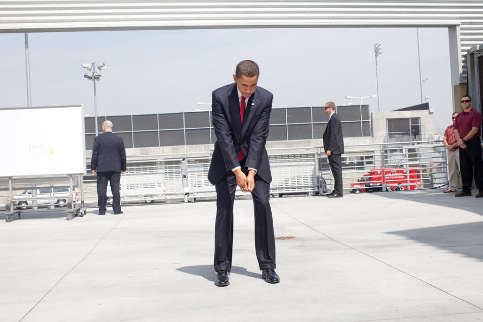 Obama practices his golf swing at an outdoor hold prior to an event at the Miguel Contreras Learning Center in Los Angeles on March 19, 2009.