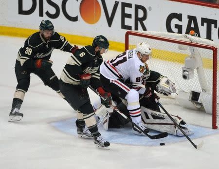 Chicago Blackhawks forward Marian Hossa (81) looks for a rebound after a save by Minnesota Wild goalie Devan Dubnyk (40) during the third period in game four of the second round of the 2015 Stanley Cup Playoffs at Xcel Energy Center. The Blackhawks defeated the Wild 4-3 sweeping the second round of playoffs. May 7, 2015; Saint Paul, Minnesota. Marilyn Indahl-USA TODAY Sports