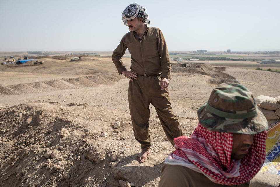 <p>Peshmerga fighters relax on a hillside position on the frontline outside the town of Altun Kubri on Oct. 23, 2017 in Altun Kubri, Iraq. Iraqi forces and Kurdish fighters have clashed over the past week after Iraqi forces took over the disputed city of Kirkuk in reaction to last month’s controversial Kurdish Independence referendum. (Photo: Chris McGrath/Getty Images) </p>