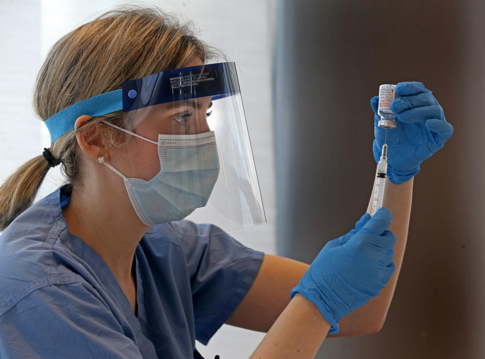 Brookline, MA. - February 25: Dr. Marisa Tieger, a physician at Massachusetts Eye and Ear fills a needle with the Moderna COVID-19 vaccine during a vaccination clinic for Holocaust survivors and their families at Congregation Kehillath Israel on February 25, 2021 in Brookline, Massachusetts.  (Staff Photo By Matt Stone/MediaNews Group/Boston Herald)