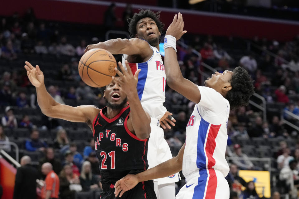 Detroit Pistons center James Wiseman (13) blocks a shot by Toronto Raptors forward Thaddeus Young (21) during the first half of an NBA basketball game, Saturday, Dec. 30, 2023 in Detroit. (AP Photo/Carlos Osorio)