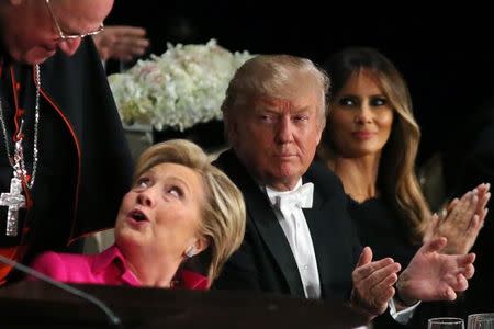 Republican U.S. presidential nominee Donald Trump looks at Democratic U.S. presidential nominee Hillary Clinton after speaking at the Alfred E. Smith Memorial Foundation dinner in New York, U.S. October 20, 2016. REUTERS/Carlos Barria