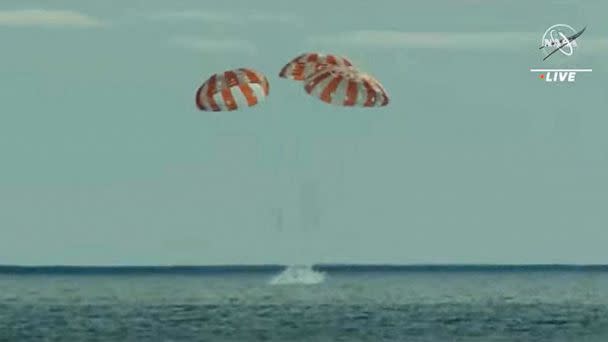 PHOTO: In this still image taken from NASA TV, NASA's unmanned Orion spaceship splashes down in the Pacific Ocean off Baja California, Mexico, Dec. 11, 2022. (Jose Romero/NASA TV/AFP via Getty Images)