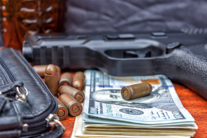 bullets, money, and a gun