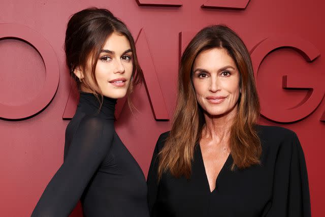 <p>Cindy Ord/Getty</p> Kaia Gerber and Cindy Crawford attend the Planet Omega exhibit on Nov. 14, 2023