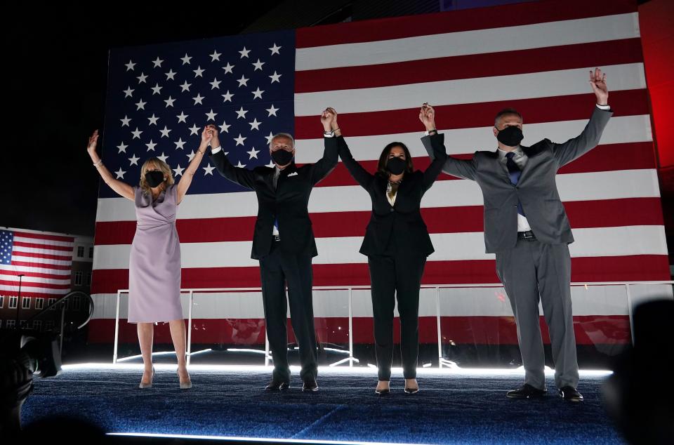 Jill Biden, presidential nominee Joe Biden, vice presidential nominee Kamala Harris and her husband, Douglas Emhoff, greet supporters in Wilmington, Delaware, on Thursday. (Photo: OLIVIER DOULIERY/Getty Images)