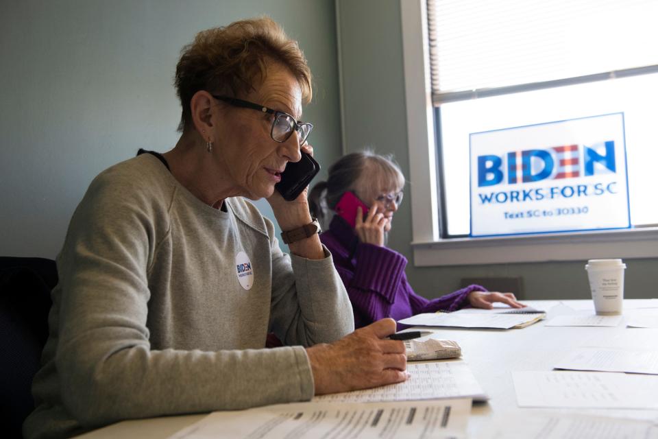 Volunteers Sherry Pittinger, left, and Ellen Martell try to rally support for Joe Biden in Greenville, S.C., on Feb. 15.