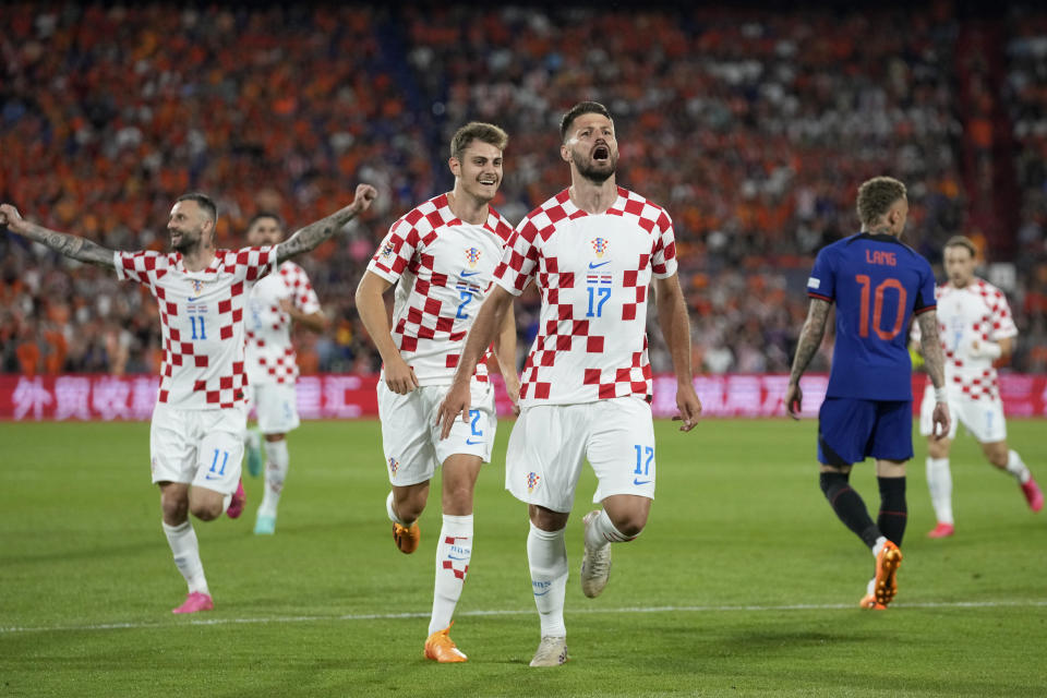 Croatia's Bruno Petkovic celebrates after scoring his side's third goal during the Nations League semifinal soccer match between the Netherlands and Croatia at De Kuip stadium in Rotterdam, Netherlands, Wednesday, June 14, 2023. (AP Photo/Peter Dejong)