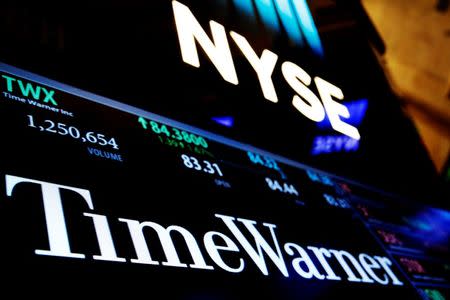 Ticker and trading information for media conglomerate Time Warner Inc. is displayed at the post where it is traded on the floor of the New York Stock Exchange (NYSE) in New York City, U.S., October 21, 2016. REUTERS/Brendan McDermid